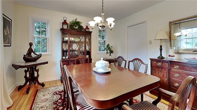 217 Monroe Dr, Ross Twp, PA 15229 - dining room with a chandelier and light wood-style flooring