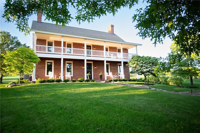 255 Camp Run Rd, Lancaster Twp, PA 16037 - back of property featuring a chimney, a lawn, and brick siding