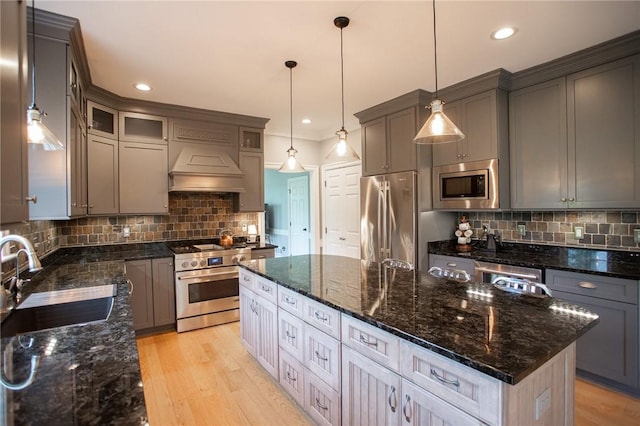 255 Camp Run Rd, Lancaster Twp, PA 16037 - kitchen with stainless steel appliances, custom exhaust hood, a center island, tasteful backsplash, and dark stone counters