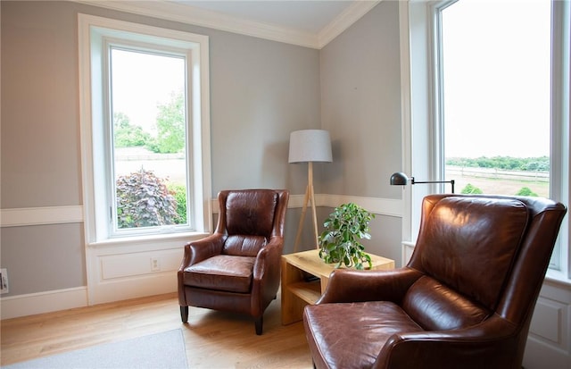 255 Camp Run Rd, Lancaster Twp, PA 16037 - living area featuring healthy amount of natural light, ornamental molding, wood finished floors, wainscoting, and a decorative wall