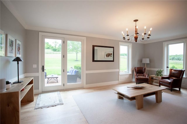 255 Camp Run Rd, Lancaster Twp, PA 16037 - living area with crown molding, a chandelier, and light wood finished floors