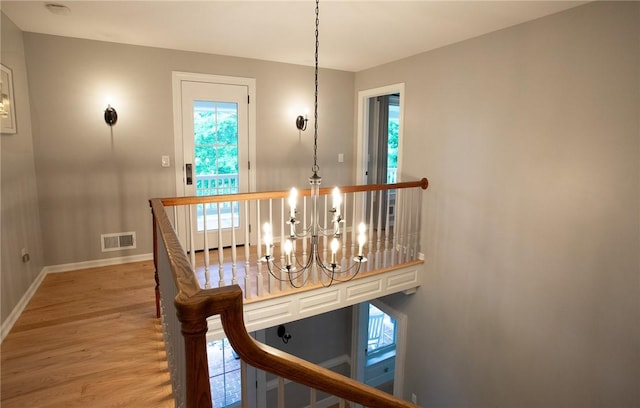 255 Camp Run Rd, Lancaster Twp, PA 16037 - staircase with a chandelier and wood finished floors