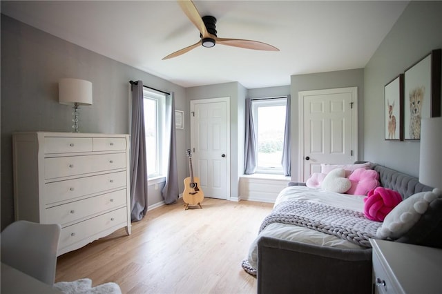 255 Camp Run Rd, Lancaster Twp, PA 16037 - bedroom with light wood-style flooring, multiple windows, and ceiling fan