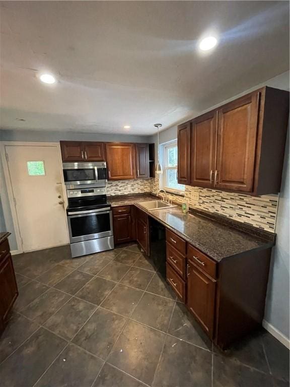 1114 Ingham St, Marshall Shadeland, PA 15212 - kitchen featuring stainless steel appliances, decorative backsplash, decorative light fixtures, recessed lighting, and dark tile patterned flooring