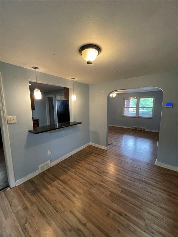 1114 Ingham St, Marshall Shadeland, PA 15212 - empty room featuring arched walkways and wood finished floors