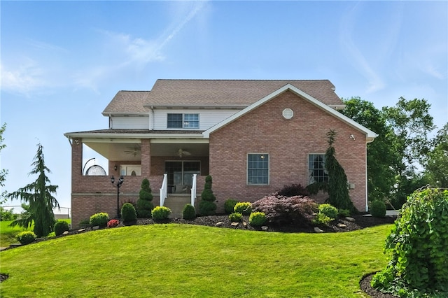 2310 Shamrock Ln, Canonsburg, PA 15317 - view of front of house with brick siding, a front lawn, ceiling fan, and covered porch