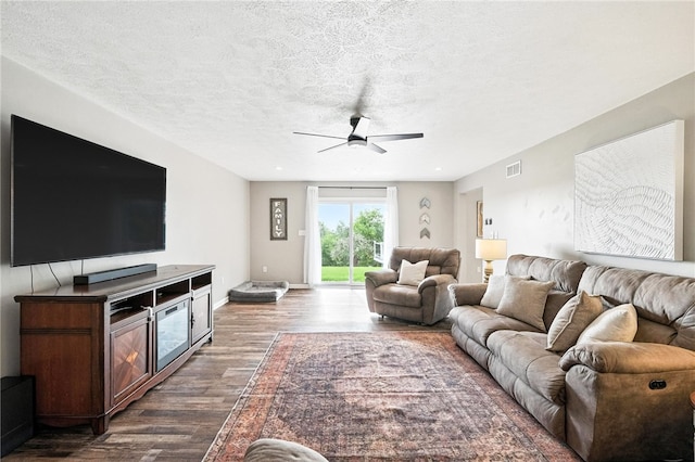 2310 Shamrock Ln, Canonsburg, PA 15317 - living room featuring dark wood-type flooring, a ceiling fan, and a textured ceiling