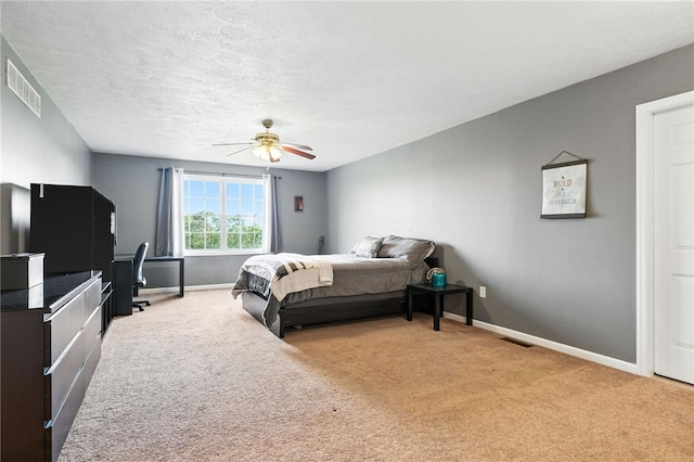 2310 Shamrock Ln, Canonsburg, PA 15317 - carpeted bedroom featuring ceiling fan, an office area, and a textured ceiling