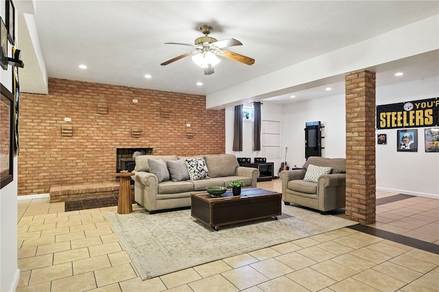 2310 Shamrock Ln, Canonsburg, PA 15317 - living room with light tile patterned floors, decorative columns, a brick fireplace, recessed lighting, and a ceiling fan