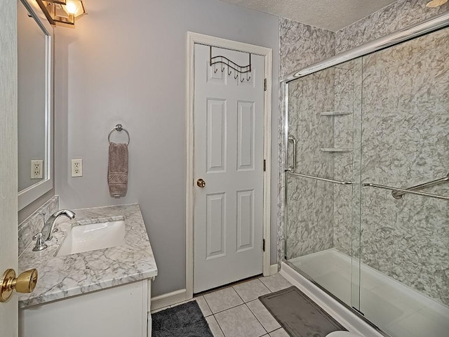 406 Country View Dr, Lower Burrell, PA 15068 - full bathroom with tile patterned flooring, vanity, a stall shower, and a textured ceiling