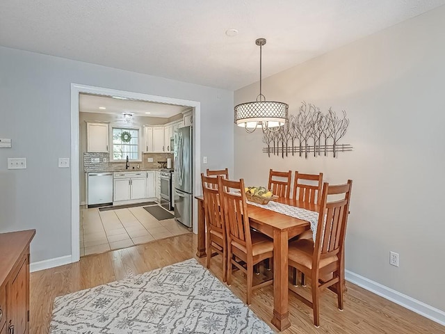 406 Country View Dr, Lower Burrell, PA 15068 - dining room featuring light wood-type flooring and a chandelier
