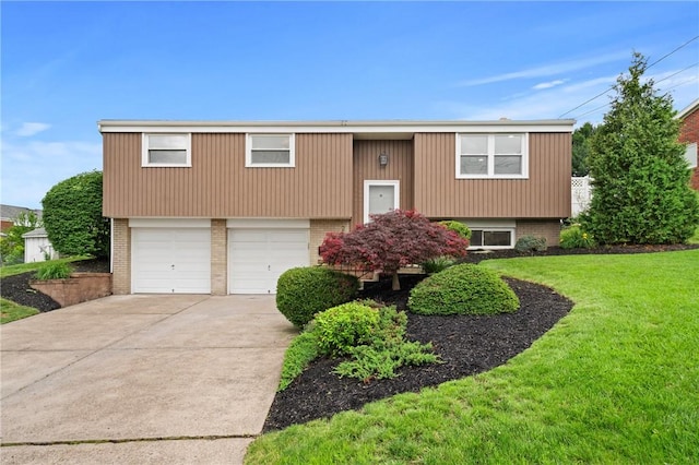 213 Thistle Dr, West Mifflin, PA 15122 - raised ranch featuring brick siding, concrete driveway, a front yard, and an attached garage