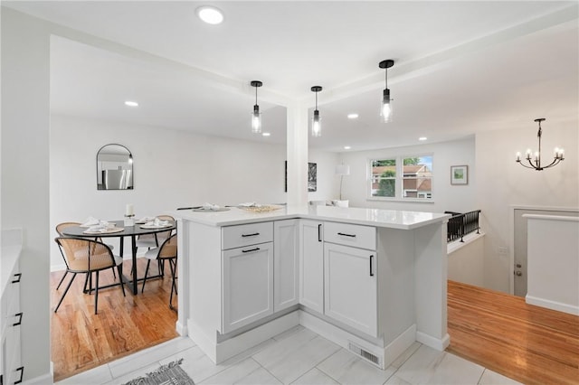 213 Thistle Dr, West Mifflin, PA 15122 - kitchen with light countertops, a chandelier, recessed lighting, and hanging light fixtures