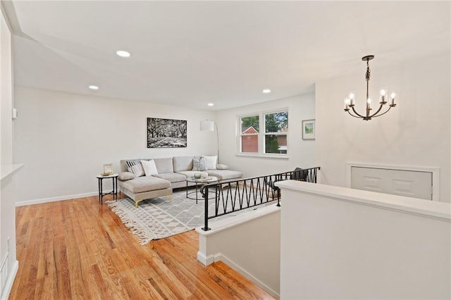 213 Thistle Dr, West Mifflin, PA 15122 - living area featuring light wood-type flooring, a chandelier, and recessed lighting