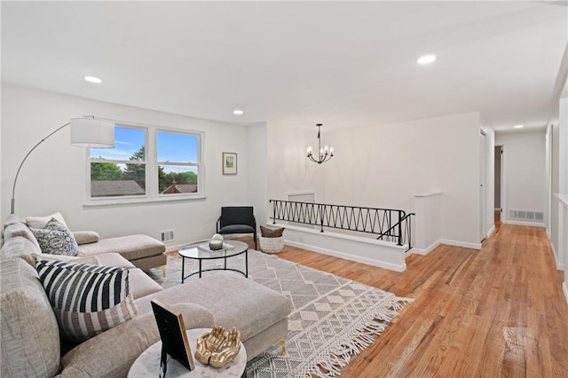 213 Thistle Dr, West Mifflin, PA 15122 - living area with a chandelier, light wood-type flooring, and recessed lighting