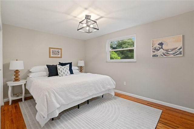 213 Thistle Dr, West Mifflin, PA 15122 - bedroom with wood finished floors and a chandelier