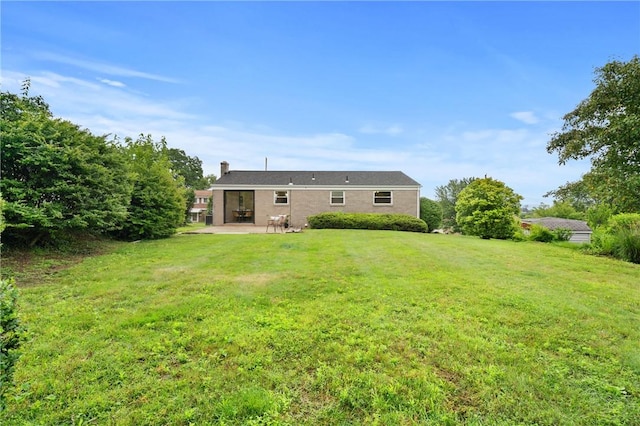 213 Thistle Dr, West Mifflin, PA 15122 - rear view of property featuring a patio and a yard