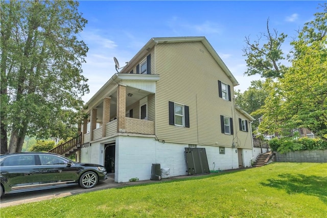 18 Allegheny Ave, South Fayette, PA 15031 - view of home's exterior featuring stairs, a yard, and an attached garage