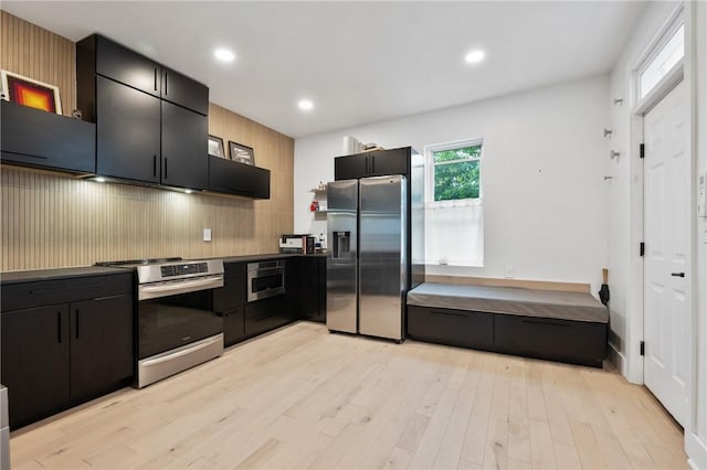 2013 Straubs Ln, Troy Hill, PA 15212 - kitchen featuring stainless steel appliances, dark cabinets, light wood-style floors, and recessed lighting