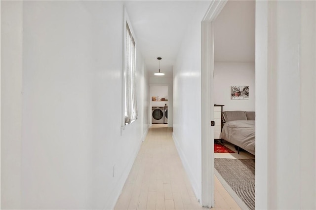 2013 Straubs Ln, Troy Hill, PA 15212 - corridor with washer and dryer and light wood finished floors