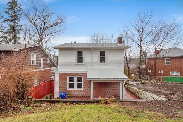 2301 Fairland St, Overbrook, PA 15210 - rear view of house with brick siding and a chimney