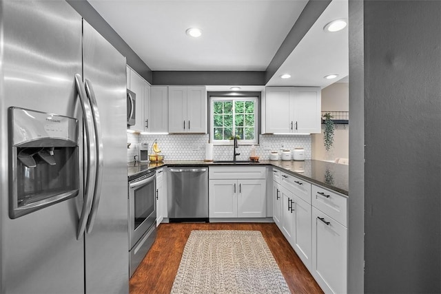 401 Olde Ingomar Ct, Mccandless, PA 15237 - kitchen with stainless steel appliances, white cabinets, dark wood-type flooring, backsplash, and recessed lighting