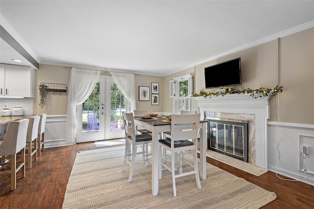 401 Olde Ingomar Ct, Mccandless, PA 15237 - dining room with a premium fireplace, ornamental molding, french doors, wood finished floors, and a wainscoted wall
