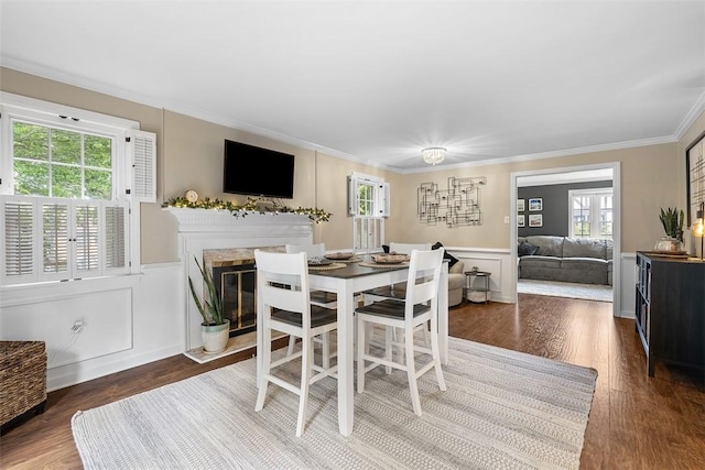 401 Olde Ingomar Ct, Mccandless, PA 15237 - dining area with wood finished floors, crown molding, a decorative wall, healthy amount of natural light, and wainscoting