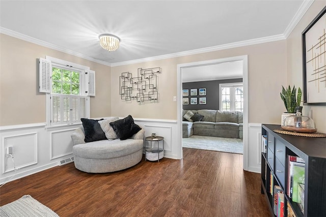 401 Olde Ingomar Ct, Mccandless, PA 15237 - living area featuring a decorative wall, wood finished floors, wainscoting, crown molding, and healthy amount of natural light