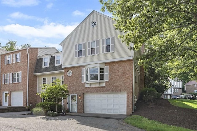 401 Olde Ingomar Ct, Mccandless, PA 15237 - view of front of home featuring brick siding, an attached garage, and asphalt driveway