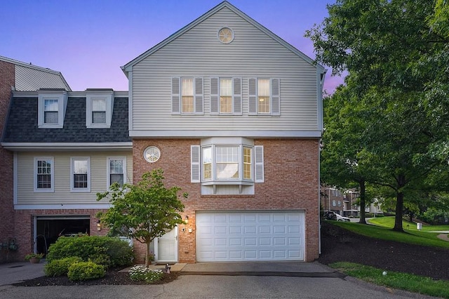 401 Olde Ingomar Ct, Mccandless, PA 15237 - view of front of house with an attached garage, asphalt driveway, brick siding, and a shingled roof