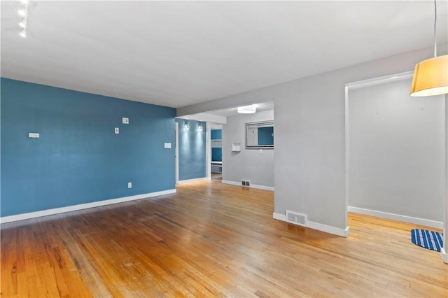 601 4th St, Penn Hills, PA 15147 - unfurnished living room featuring wood finished floors and baseboards