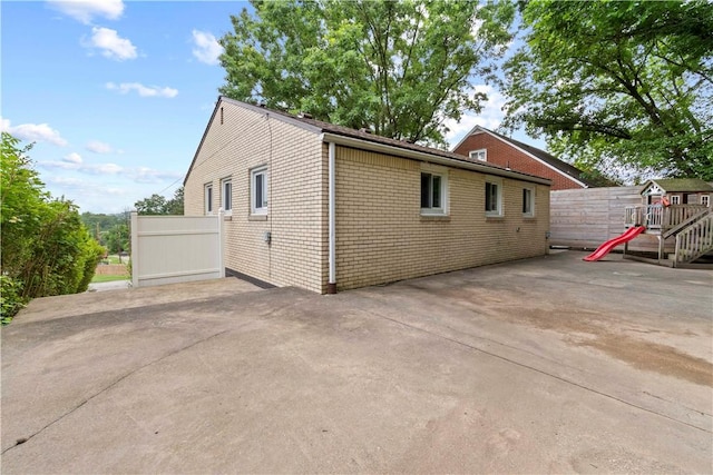 601 4th St, Penn Hills, PA 15147 - view of side of property with a patio area and a playground