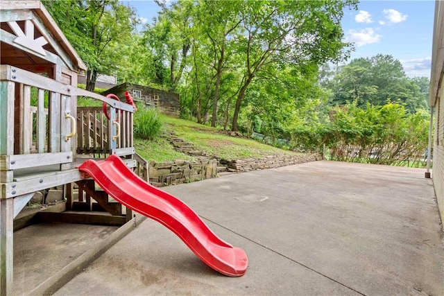 601 4th St, Penn Hills, PA 15147 - view of playground featuring view of wooded area and a patio