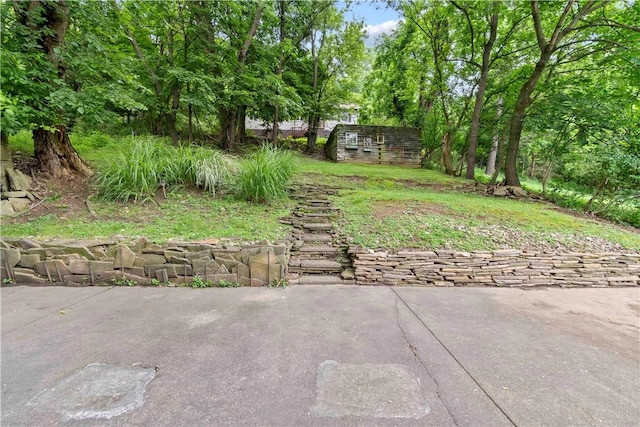 601 4th St, Penn Hills, PA 15147 - view of yard featuring a storage shed and a patio area