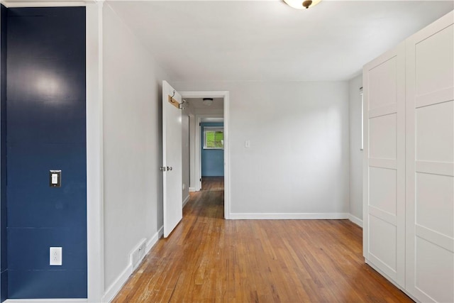 601 4th St, Penn Hills, PA 15147 - unfurnished bedroom with light wood-style floors and a closet