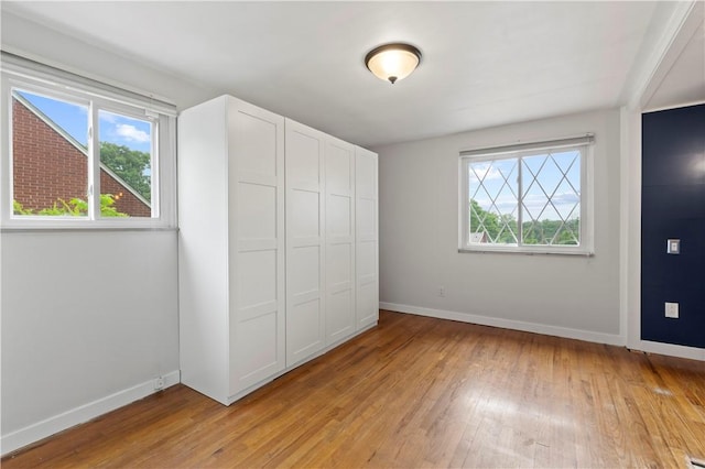 601 4th St, Penn Hills, PA 15147 - unfurnished bedroom with light wood-style floors and a closet