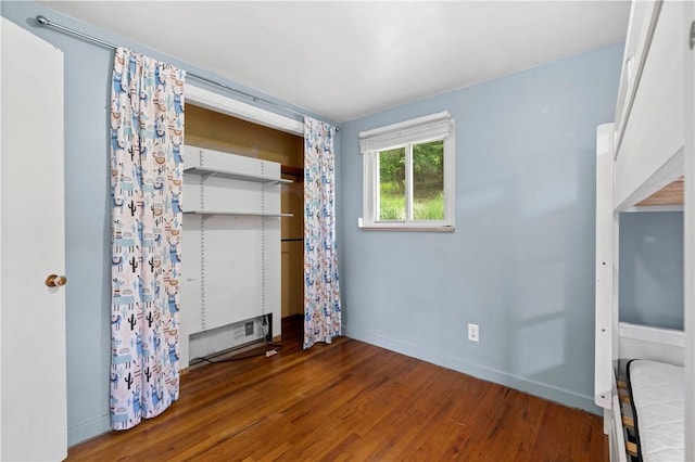 601 4th St, Penn Hills, PA 15147 - unfurnished bedroom featuring wood finished floors and a closet