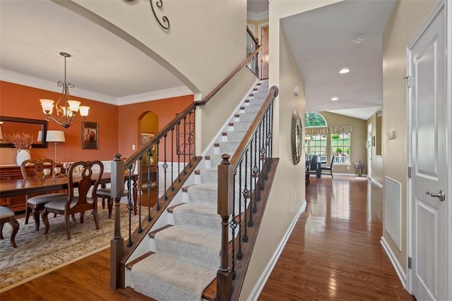 743 Packsaddle Trl, Richland, PA 15044 - stairs with wood finished floors, arched walkways, a chandelier, crown molding, and recessed lighting
