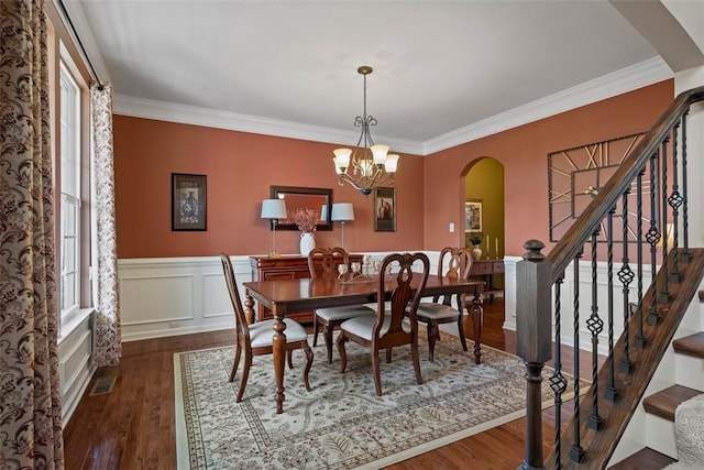743 Packsaddle Trl, Richland, PA 15044 - dining space featuring arched walkways, stairway, plenty of natural light, wood finished floors, and a wainscoted wall