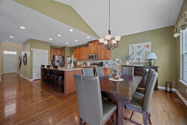 743 Packsaddle Trl, Richland, PA 15044 - dining room featuring wood finished floors, a chandelier, vaulted ceiling, and recessed lighting