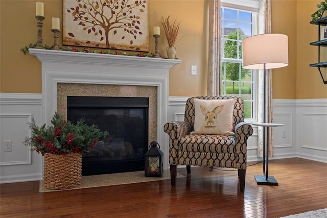 743 Packsaddle Trl, Richland, PA 15044 - living area with a wainscoted wall, a decorative wall, wood finished floors, and a glass covered fireplace
