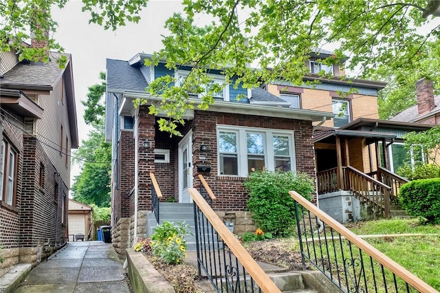 2267 Tilbury Ave, Squirrel Hill, PA 15217 - view of front of home with brick siding, a detached garage, and roof with shingles