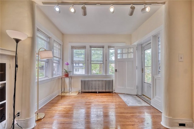 2267 Tilbury Ave, Squirrel Hill, PA 15217 - foyer featuring radiator heating unit, rail lighting, and healthy amount of natural light