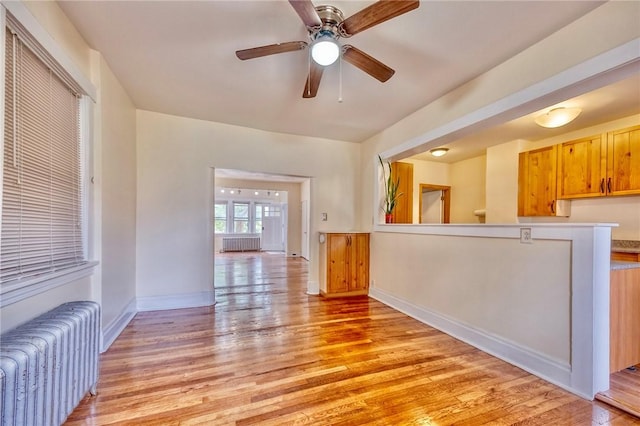 2267 Tilbury Ave, Squirrel Hill, PA 15217 - unfurnished living room featuring radiator, light wood-style flooring, and ceiling fan