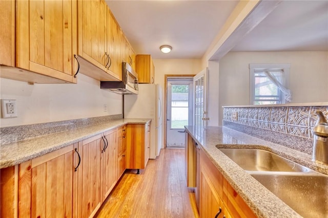 2267 Tilbury Ave, Squirrel Hill, PA 15217 - kitchen with plenty of natural light, light wood-type flooring, and light stone countertops