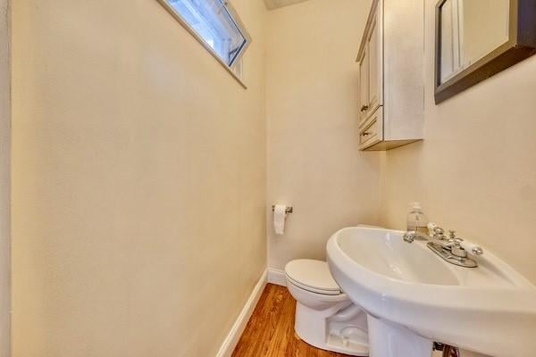 2267 Tilbury Ave, Squirrel Hill, PA 15217 - half bathroom featuring toilet and wood finished floors