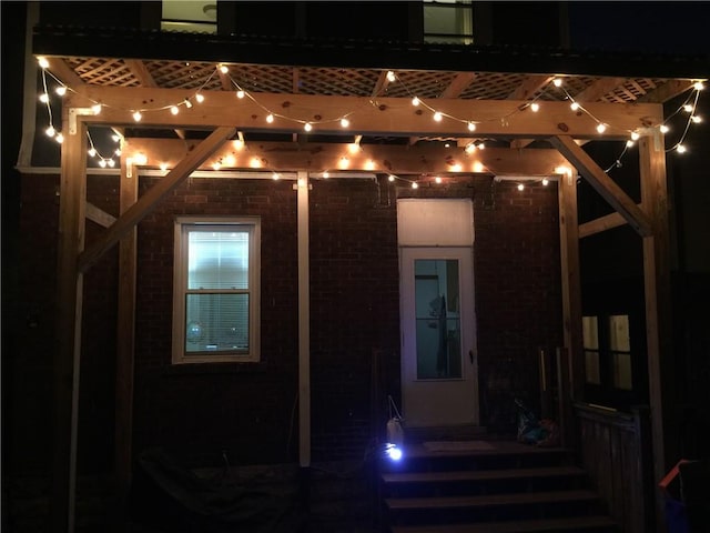 2267 Tilbury Ave, Squirrel Hill, PA 15217 - exterior entry at twilight featuring brick siding and a pergola