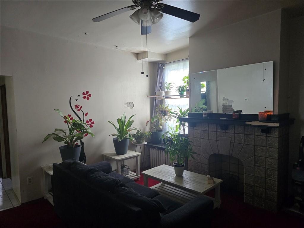 1000 Washington, Port Vue, PA 15133 - living room with ceiling fan, a fireplace, and radiator