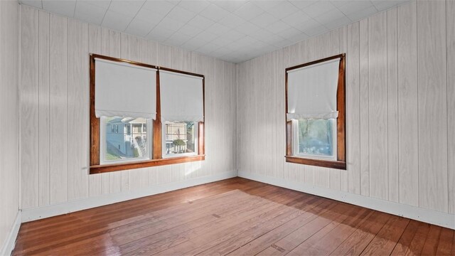 304 Wylie Ave, Elizabeth Twp/Boro, PA 15037 - empty room with wood-type flooring and wood walls